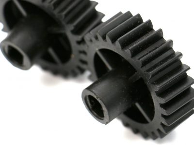picture of a black old plastic dirty cogwheel